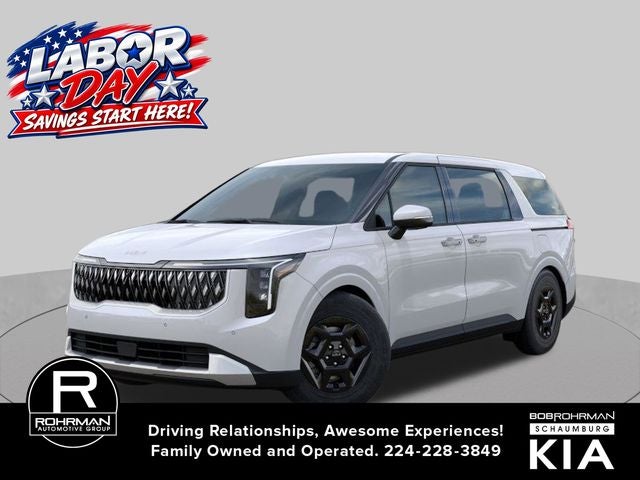 2026 Kia Carnival LX in Snow White Pearl — front three-quarter view