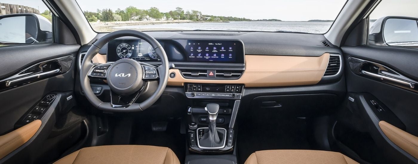 Tan leather upholstery in the cabin of a 2025 Kia Seltos for sale.